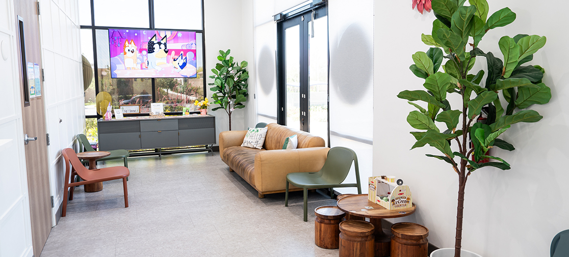 Go Kids Dental colorful reception room showing chairs, armchairs and play area